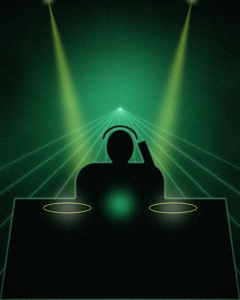 A DJ in the booth with green lasers behind