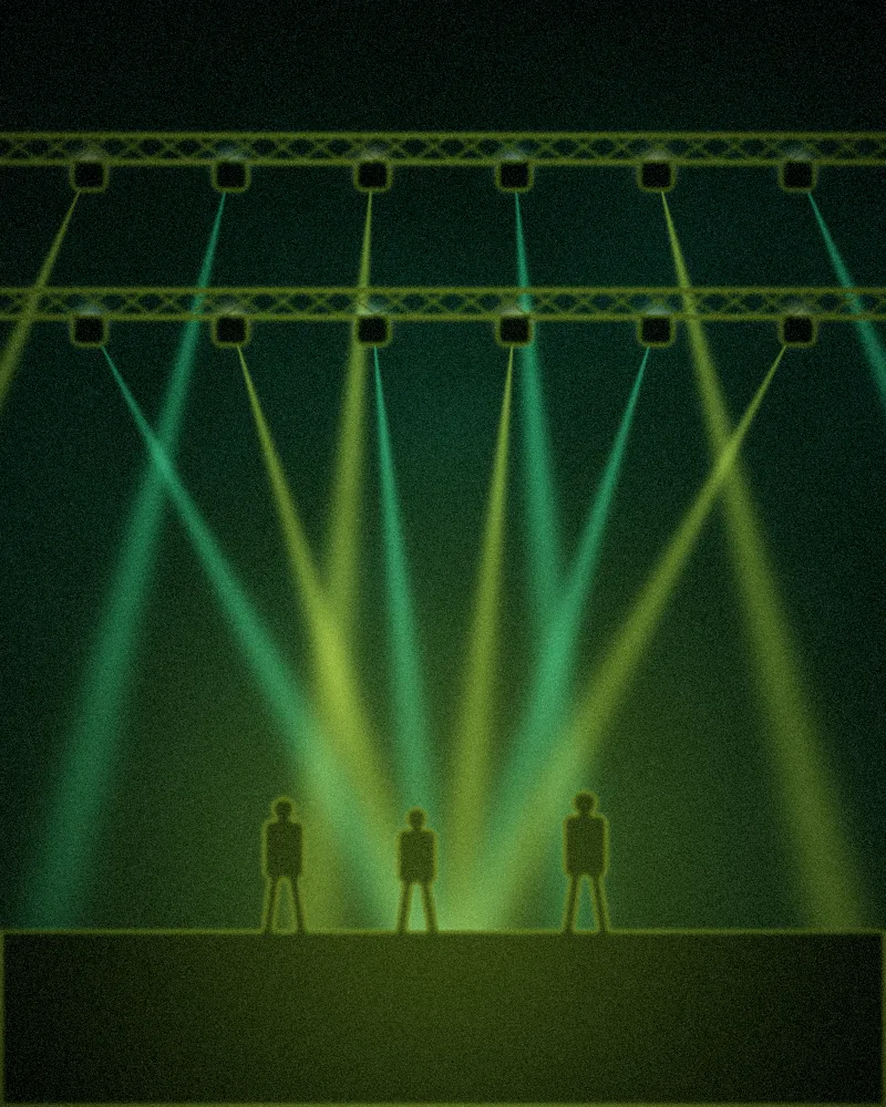 Lighting rigs above a stage with three people walking it